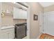 Neat laundry room featuring modern washer and dryer, sink, cabinets and plenty of storage at 2000 Silverleaf Dr, Youngsville, NC 27596