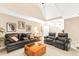 Comfortable living room featuring a black leather sofa and chairs, complemented by plush carpeting and neutral paint at 2000 Silverleaf Dr, Youngsville, NC 27596