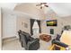 Cozy living room with plush seating, large TV, and skylight at 2000 Silverleaf Dr, Youngsville, NC 27596