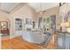 Bright living room with high ceilings, built-in shelving, fireplace, and hardwood floors at 2000 Silverleaf Dr, Youngsville, NC 27596