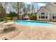 Large backyard swimming pool with a patio table and chairs at 2000 Silverleaf Dr, Youngsville, NC 27596