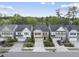 Aerial view showcasing the neighborhood's well-maintained lawns, mature trees and charming two-story homes at 204 Concordia Woods Dr, Morrisville, NC 27560