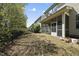 Backyard showing the screened-in porch and mature trees at 204 Concordia Woods Dr, Morrisville, NC 27560