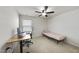 This bedroom features a ceiling fan, neutral walls, plush carpet, desk, and a window providing natural light at 204 Concordia Woods Dr, Morrisville, NC 27560