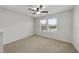 Comfortable bedroom with neutral carpet, a ceiling fan, and two windows offering plenty of natural light at 204 Concordia Woods Dr, Morrisville, NC 27560