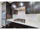 Close up of updated kitchen featuring stainless steel appliances, white subway tile backsplash, and quartz countertops at 204 Concordia Woods Dr, Morrisville, NC 27560