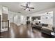 Spacious living room with hardwood floors, open to kitchen with modern finishes, and plenty of natural light at 204 Concordia Woods Dr, Morrisville, NC 27560
