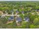 An aerial view of a neighborhood with mature trees and manicured lawns at 212 Hein Dr, Clayton, NC 27527