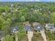 An aerial view of a neighborhood surrounded by green trees at 212 Hein Dr, Clayton, NC 27527