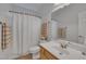 Simple bathroom with a shower/tub combo, single sink vanity, and neutral decor at 212 Hein Dr, Clayton, NC 27527