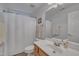 Simple bathroom with a shower/tub combo, single sink vanity, and neutral decor at 212 Hein Dr, Clayton, NC 27527