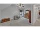 Bonus room with chair, storage chest, mirror, and large window at 212 Hein Dr, Clayton, NC 27527