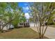 Charming home with a welcoming front porch, attached two-car garage, and well-manicured lawn at 212 Hein Dr, Clayton, NC 27527