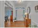 Bright foyer with hardwood floors, white trim, and a view into the dining area at 212 Hein Dr, Clayton, NC 27527