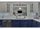 Close-up of bright kitchen with stainless steel appliances, beautiful countertops and stylish two-toned cabinetry at 212 Hein Dr, Clayton, NC 27527