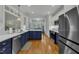 Bright kitchen with stainless steel appliances, beautiful countertops and stylish two-toned cabinetry at 212 Hein Dr, Clayton, NC 27527