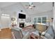 Inviting living room with a fireplace, built-in shelving, and plenty of natural light at 212 Hein Dr, Clayton, NC 27527
