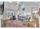 Bright living room with vaulted ceilings, skylights, and a cozy seating area at 212 Hein Dr, Clayton, NC 27527