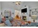 Inviting living room with a fireplace, built-in shelving, and plenty of natural light at 212 Hein Dr, Clayton, NC 27527