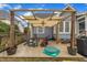 Outdoor pergola seating area with sunshade offering an ideal spot for relaxing at 212 Hein Dr, Clayton, NC 27527