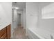 Well-lit bathroom boasts a large tub, separate shower, and convenient vanity with ample counter space at 2214 Bayswater Dr, Creedmoor, NC 27522