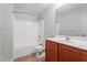 Bathroom featuring grey walls, a shower/bathtub combo, and a sink with brown cabinets at 2214 Bayswater Dr, Creedmoor, NC 27522