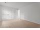 Bedroom featuring neutral carpet, white walls, and two white doors at 2214 Bayswater Dr, Creedmoor, NC 27522