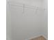 Walk-in closet features white walls, beige carpet and wire shelving for organizing your wardrobe at 2214 Bayswater Dr, Creedmoor, NC 27522