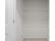 Walk-in closet with white wire shelving for storage and organization at 2214 Bayswater Dr, Creedmoor, NC 27522