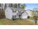 Well-kept two-story home with light gray siding, an attached garage, and green lawn at 2214 Bayswater Dr, Creedmoor, NC 27522