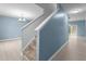 Bright entryway features a staircase and open access to the living areas with consistent flooring at 2214 Bayswater Dr, Creedmoor, NC 27522