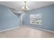 Open-plan space with new floors, paint, staircase, and large window providing natural light at 2214 Bayswater Dr, Creedmoor, NC 27522