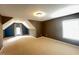 A spacious bedroom with natural light and a unique architectural design on the upper floor at 222 Creststone Dr, Cary, NC 27519