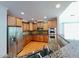 Open kitchen featuring granite countertops, stainless steel appliances, and custom cabinetry at 222 Creststone Dr, Cary, NC 27519