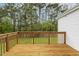 Wooden deck overlooking a grassy backyard with mature trees at 225 Lodestone Dr, Durham, NC 27703