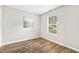 Bright bedroom with hardwood floors, neutral paint and one sun-filled window at 225 Lodestone Dr, Durham, NC 27703