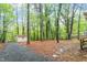 Spacious backyard with mature trees and detached shed at 2314 Clements Dr, Durham, NC 27704