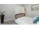 Neutral bedroom with closet featuring ample storage, a wood frame bed, and stylish décor at 2314 Clements Dr, Durham, NC 27704