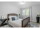 Well-lit bedroom with wood-look floors and large windows providing ample natural light at 2314 Clements Dr, Durham, NC 27704