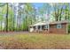 Quaint single-story home surrounded by mature trees in a serene setting at 2314 Clements Dr, Durham, NC 27704