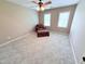Bedroom featuring two windows that provide natural light and a cozy chair at 2385 Olde Spring Ct, Graham, NC 27253