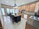 Kitchen with wood cabinets, granite countertops, and center island with seating at 2385 Olde Spring Ct, Graham, NC 27253