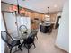Eat-in kitchen area features wood cabinets, a center island, and black kitchen table at 2385 Olde Spring Ct, Graham, NC 27253