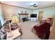 Inviting living room features a stone fireplace and comfortable, patterned seating at 2385 Olde Spring Ct, Graham, NC 27253