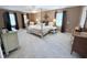 Light-filled main bedroom offers plush carpet, neutral walls, and nice furnishings at 2385 Olde Spring Ct, Graham, NC 27253