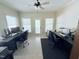 Bright home office with tile flooring, two desks, and a door to the outside at 2385 Olde Spring Ct, Graham, NC 27253