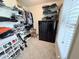 Walk-in closet with built-in shelving, a safe, and ample space for clothes at 2385 Olde Spring Ct, Graham, NC 27253