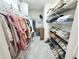 Well-organized walk-in closet provides ample storage space with shelves and racks at 2385 Olde Spring Ct, Graham, NC 27253