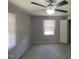 Bedroom featuring a ceiling fan, carpeted flooring, and a large window at 24 Pine St, Franklinton, NC 27525