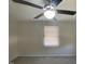 Bedroom featuring a ceiling fan, carpeted flooring, and a large window at 24 Pine St, Franklinton, NC 27525